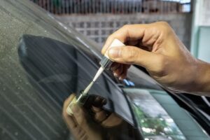Clear nail polish is a temporary solution to stop the chip in windshield