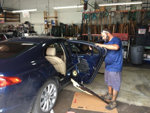 A man setting automatic window lock for door in Homestead, FL